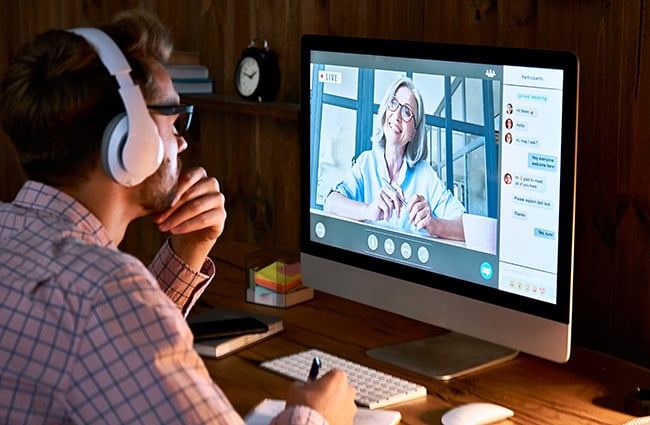 Man wearing headphones during virtual meeting