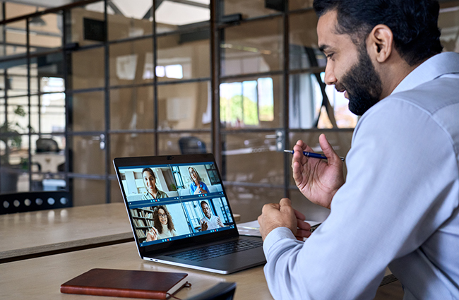 Man connecting with classmates on virtual class